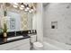 Well-lit bathroom features stylish wallpaper and a shower with a white marble surround at 3915 Corsica Pl, Wesley Chapel, FL 33543