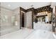 Bright bathroom features a soaking tub, walk-in shower, and modern vanity at 3915 Corsica Pl, Wesley Chapel, FL 33543