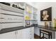 Inspiring craft room with custom cabinets, desk, and clever storage to spark your creative projects at 3915 Corsica Pl, Wesley Chapel, FL 33543