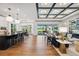 Open-concept kitchen featuring an island with counter seating, modern appliances, and seamless flow to the living area at 3915 Corsica Pl, Wesley Chapel, FL 33543