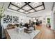 Spacious living room featuring modern decor and hardwood floors throughout open floor plan at 3915 Corsica Pl, Wesley Chapel, FL 33543