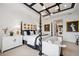 Beautiful main bedroom featuring a decorative ceiling and a four-poster bed at 3915 Corsica Pl, Wesley Chapel, FL 33543