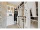 Walk-in closet with custom organizers, a luxe robe, and ample space for clothes and luggage at 3915 Corsica Pl, Wesley Chapel, FL 33543