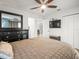 Primary bedroom with a ceiling fan, dresser, TV and closet at 4128 Camelia Dr, Hernando Beach, FL 34607