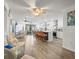 Open-concept kitchen and dining area with an island, bar stool seating, and sliding doors leading to the outdoors at 4128 Camelia Dr, Hernando Beach, FL 34607