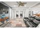 Comfortable living room including large TV and ceiling fan with access to patio at 4128 Camelia Dr, Hernando Beach, FL 34607