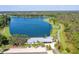 Aerial view of community lake with surrounding walking trails and amenities at 4188 Barbour Trl, Odessa, FL 33556