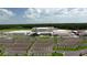 Aerial view of the new school featuring ample parking, green spaces, and modern architecture at 4188 Barbour Trl, Odessa, FL 33556