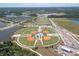 Aerial view showcases sports complex with well-maintained baseball fields, tennis courts and ample parking at 4188 Barbour Trl, Odessa, FL 33556