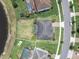 Aerial view showcases a large lot with well-maintained backyard adjacent to the neighborhood street at 4188 Barbour Trl, Odessa, FL 33556