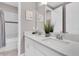 Bright bathroom with double sinks, marble countertops, and modern finishes at 4188 Barbour Trl, Odessa, FL 33556