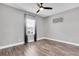 Bright bedroom features a window, wood floors, and modern decor at 4188 Barbour Trl, Odessa, FL 33556