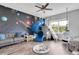 Bedroom with a sofa, space decor, a slide and play area at 4188 Barbour Trl, Odessa, FL 33556