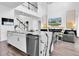 Kitchen island with marble countertops and views of the open living space at 4188 Barbour Trl, Odessa, FL 33556
