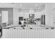 Spacious modern kitchen featuring a large island with unique countertops and stainless steel appliances at 4188 Barbour Trl, Odessa, FL 33556