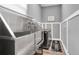Well designed laundry room featuring a stainless steel dog bath and modern washer and dryer at 4188 Barbour Trl, Odessa, FL 33556