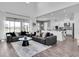 Open-concept living room featuring modern furnishings and access to the kitchen at 4188 Barbour Trl, Odessa, FL 33556