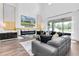 Bright living room showcasing soaring ceilings, a fireplace, and a large sliding glass door at 4188 Barbour Trl, Odessa, FL 33556