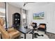 Modern office space with sleek furniture, ample natural light, and a stylish cowhide rug at 4188 Barbour Trl, Odessa, FL 33556