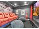 Home theater with comfortable seating, a projector, and a large screen for entertainment at 4188 Barbour Trl, Odessa, FL 33556