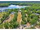 A sprawling property featuring a well-manicured lawn, mature trees, and an inviting home, creating a park-like setting at 4541 School Rd, Land O Lakes, FL 34638