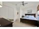 Comfortable bedroom featuring a dark wood bed frame and furnishings with a closet at 4541 School Rd, Land O Lakes, FL 34638
