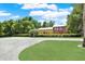 Beautiful property showcasing a spacious lawn, mature trees, and a classic two-story home at 4541 School Rd, Land O Lakes, FL 34638