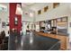Spacious kitchen boasts black countertops, wood cabinets, and stainless steel appliances at 4541 School Rd, Land O Lakes, FL 34638