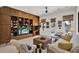Cozy living room with a large built-in wooden entertainment center and a neutral color palette at 4541 School Rd, Land O Lakes, FL 34638
