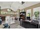 Comfortable home office featuring lots of natural light, vaulted ceilings, and an executive desk setup at 4541 School Rd, Land O Lakes, FL 34638