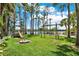 Beautiful playground with swings and slide, nestled on manicured lawn near a waterfront setting at 4541 School Rd, Land O Lakes, FL 34638
