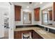 Bathroom with granite counters, modern cabinets, and mirrors at 4550 Bay Blvd # 1231, Port Richey, FL 34668
