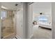 Bathroom with tiled shower and view to bedroom at 4550 Bay Blvd # 1231, Port Richey, FL 34668
