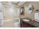 Bathroom featuring a bathtub-shower combination and a vanity with granite countertop at 4550 Bay Blvd # 1231, Port Richey, FL 34668