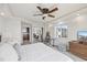 Bright bedroom featuring a ceiling fan, and modern furniture with a serene aesthetic and outside views at 4550 Bay Blvd # 1231, Port Richey, FL 34668