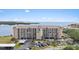 Stunning condo exterior showcasing meticulously maintained landscaping, covered parking, and serene waterfront views at 4550 Bay Blvd # 1231, Port Richey, FL 34668