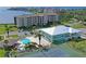 A view of the property featuring a pool, tennis court, and lush landscaping, providing outdoor enjoyment at 4550 Bay Blvd # 1231, Port Richey, FL 34668