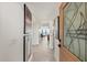 Inviting entryway with elegant tile flooring, artwork, and a clear view into the living room with water views at 4550 Bay Blvd # 1231, Port Richey, FL 34668