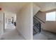 Hallway leading to stairwell with natural light at 4550 Bay Blvd # 1231, Port Richey, FL 34668