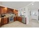 Well-equipped kitchen with stainless appliances, custom wood cabinets, granite countertops and an open layout at 4550 Bay Blvd # 1231, Port Richey, FL 34668