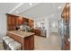 Updated kitchen with stainless steel appliances, granite counters, and views into the dining area and kitchen at 4550 Bay Blvd # 1231, Port Richey, FL 34668