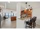 Gourmet kitchen with beautiful wood cabinetry, granite countertops, stainless steel appliances, and an open view to the living area at 4550 Bay Blvd # 1231, Port Richey, FL 34668