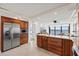 Kitchen featuring stainless steel appliances, wood cabinets, granite counters, and beautiful views from the kitchen island at 4550 Bay Blvd # 1231, Port Richey, FL 34668