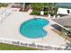 A kidney-shaped pool with poolside seating offers residents a relaxing spot for swimming and sunbathing at 4550 Bay Blvd # 1231, Port Richey, FL 34668