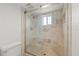 Bathroom with tiled shower and glass door at 4550 Bay Blvd # 1231, Port Richey, FL 34668