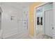 Bright and functional bathroom featuring bathtub with shower and a seamless transition to the hallway at 4918 Forecastle Dr, New Port Richey, FL 34652