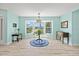Bright dining area featuring large windows, neutral paint, and wood flooring at 4918 Forecastle Dr, New Port Richey, FL 34652