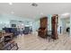 Spacious living room featuring hardwood floors, lots of seating, and open access to the waterfront view at 4918 Forecastle Dr, New Port Richey, FL 34652