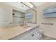 Bathroom vanity features a marble countertop and modern fixtures at 5113 Cedar Ln, Brooksville, FL 34601