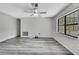 Living room with modern wood-look floors and ample natural light at 5113 Cedar Ln, Brooksville, FL 34601